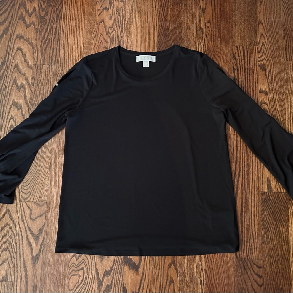 Micheal Kors black top with partially open sleeves and gold studs